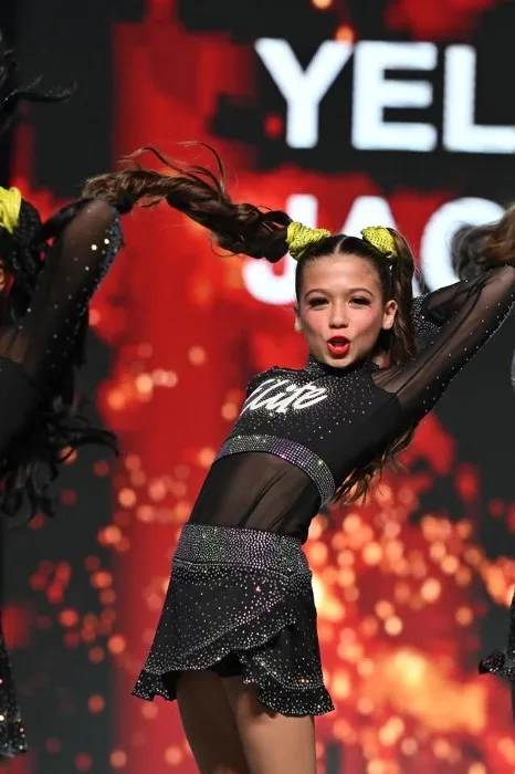 Elite Cheer athlete performing a routine at a competition