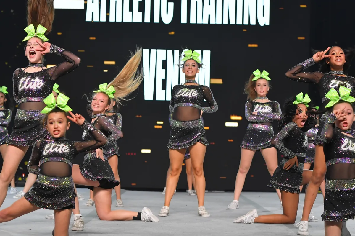 Elite Cheer all-star team performing on the competition mat